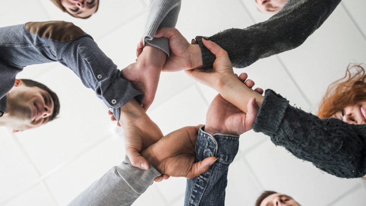 community-concept-with-hands-people-scaled